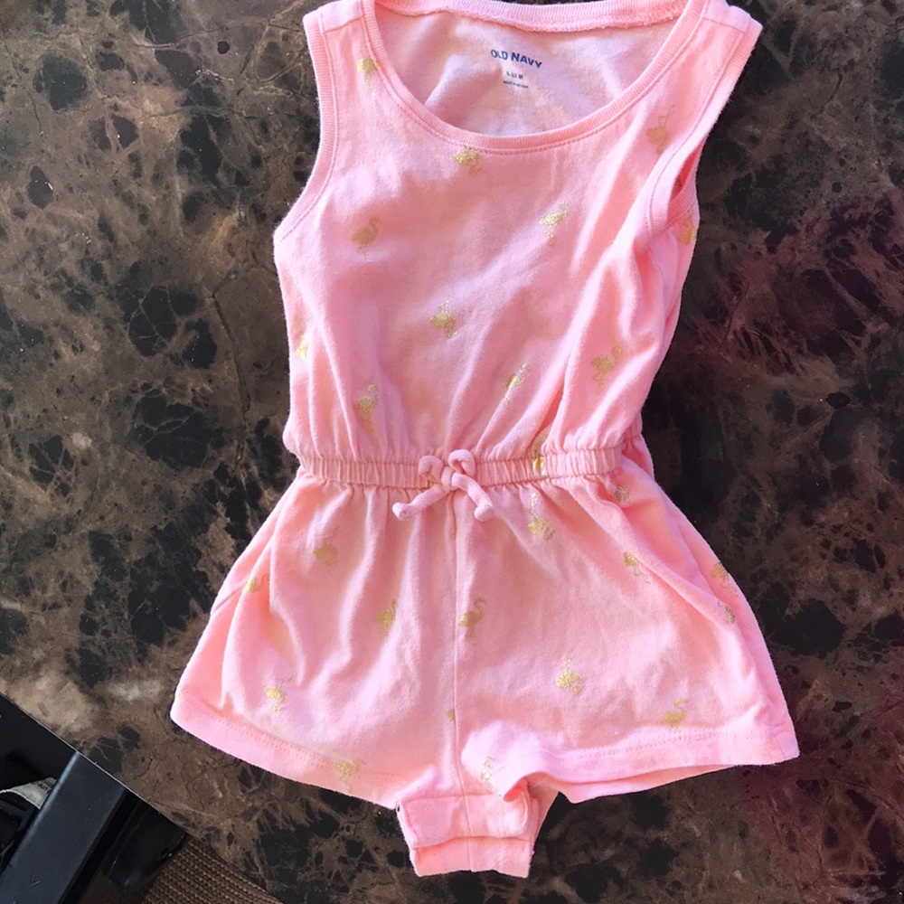 Peach romper with gold flamingos